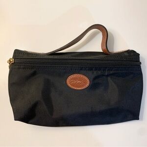 Longchamp small toiletries/makeup bag. Like new.